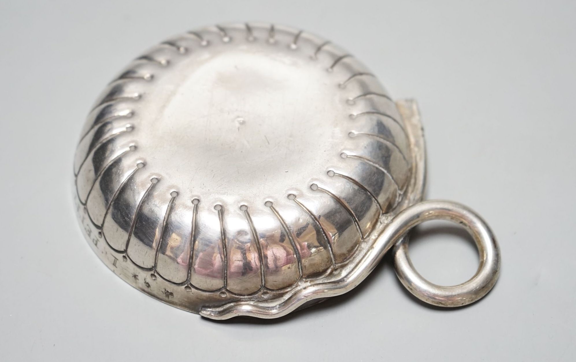 A late 18th/early 19th century French white metal taste vin, with engraved inscription and ring handle, 11.6cm over handle, 122 grams.